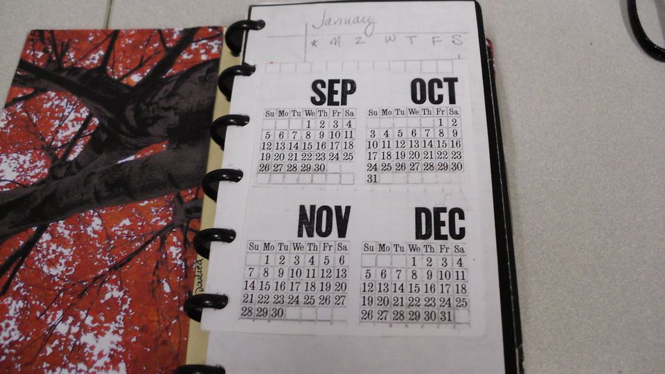 Desk calendar open at September to December