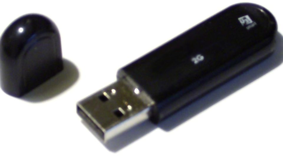 Black USB flash drive with its cap removed