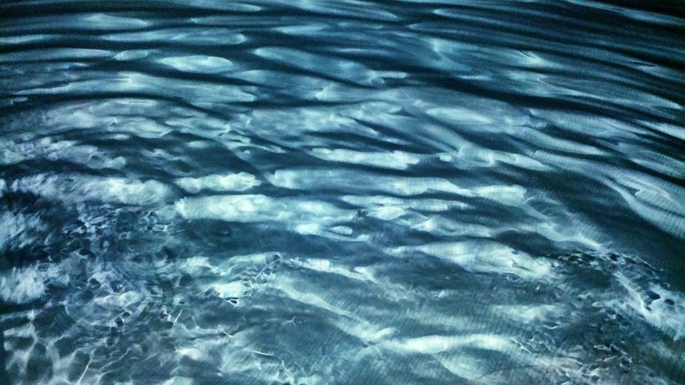 Rippling blue water in a swimming pool