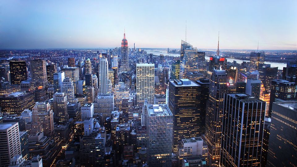 City skyline of tall buildings at dusk