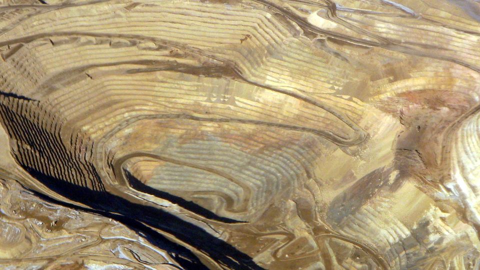 Aerial view of terraced open-pit mine