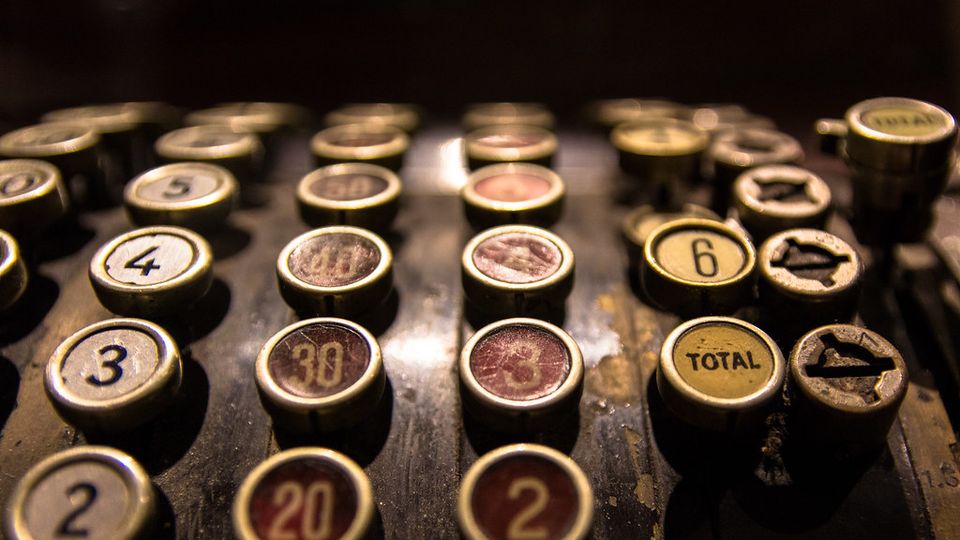Close-up of old cash register keys