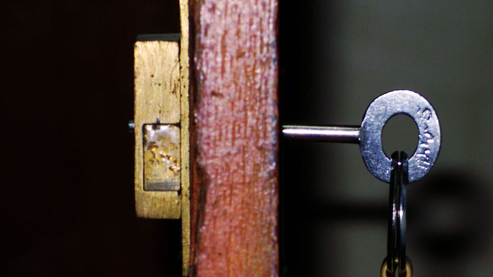 Key inserted into an old door lock